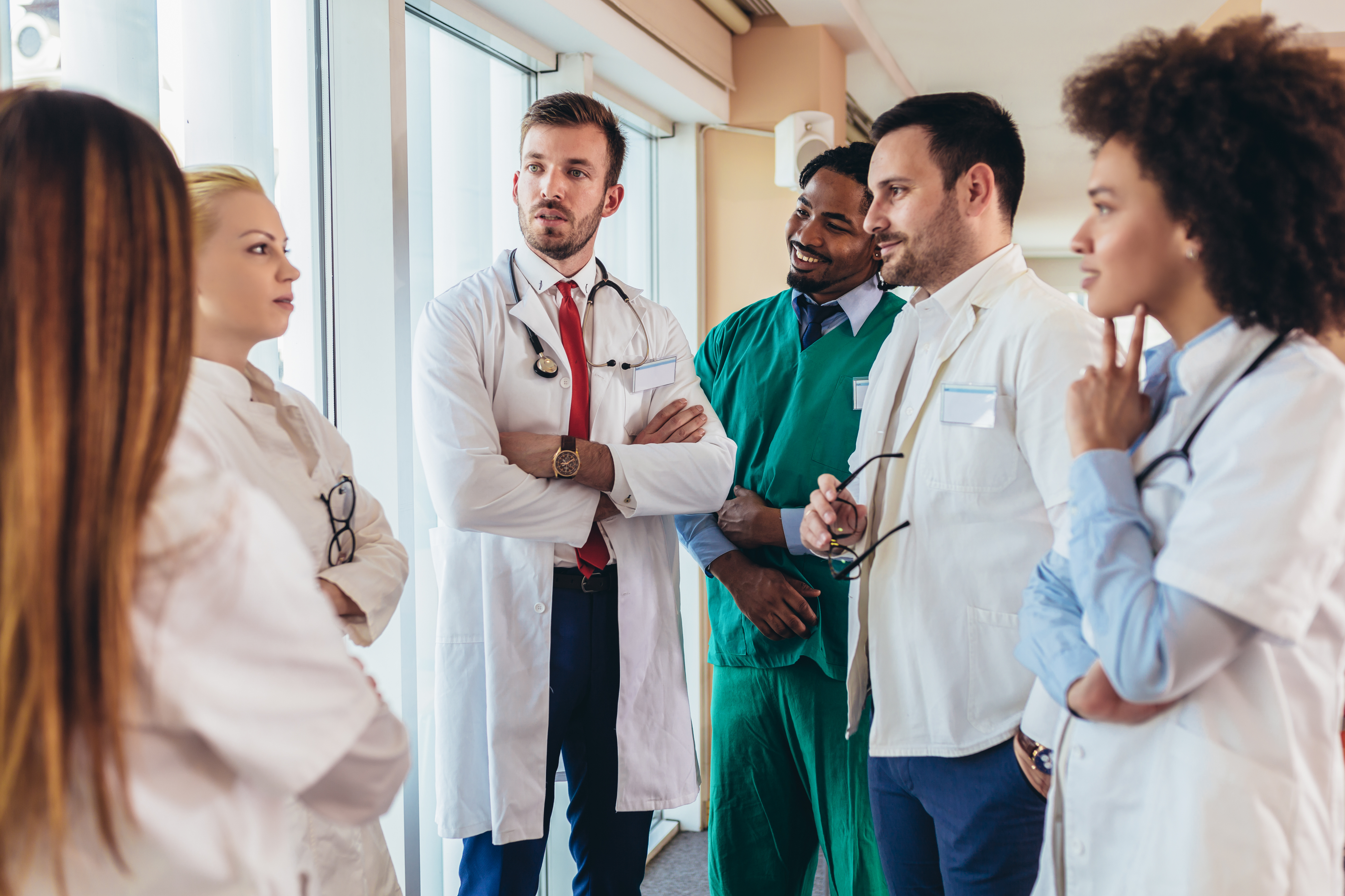 Image of medical professionals standing in a semi-circle