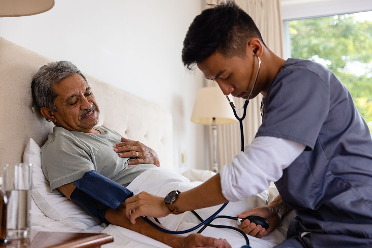 Image of someone taking a patient's blood pressure