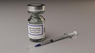 Image of Bivalent COVID vaccine and needle 
