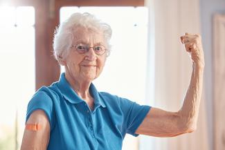 Image of elderly woman flexing 