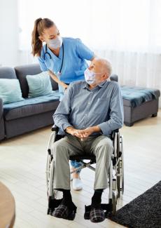 Nurse doctor senior caregiver help assistance wheelchair retirement home nursing patient.