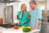 Middle aged couple having fun home cooking, health, wellness, low calorie, diet and nutrition