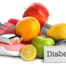 Composition with digital glucometer, sneakers, dumbbells and fruits on white background