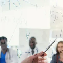 Group of medical professionals collaborating on a digital whiteboard
