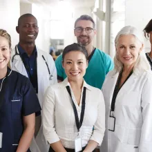 Portrait Of Medical Team Standing In Hospital Corridor