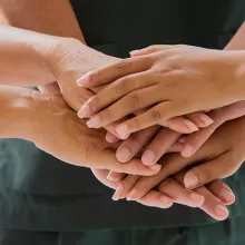 Doctors and nurses coordinate hands. Concept Teamwork in hospital for success work and trust in team