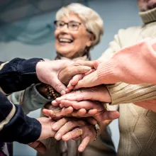 Group of seniors making activities inside the hospice.