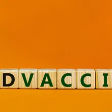 Image of blocks that spell out COVID vaccine