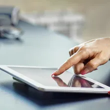 Clinician working on a digital tablet 