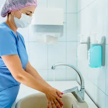 Image of healthcare worker washing hands before surgery