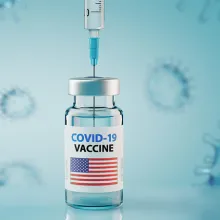 COVID vaccine vile with a USA flag