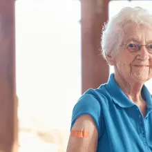 elderly person flexing arm