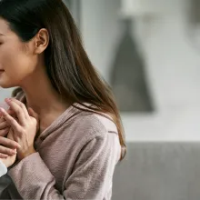 daughter comforting elderly mother