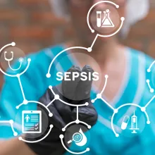Clinician touching digital layout that says sepsis 
