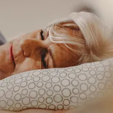 Older woman laying down sleep