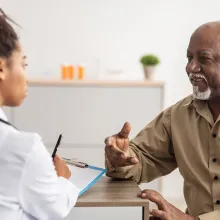 Patient talking to clinician during appointment