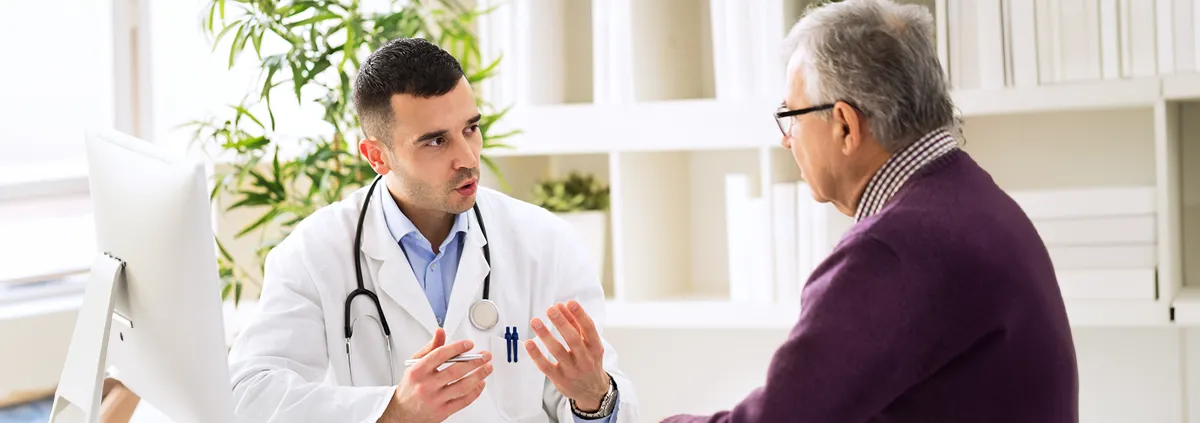 Clinician talking with a patient 