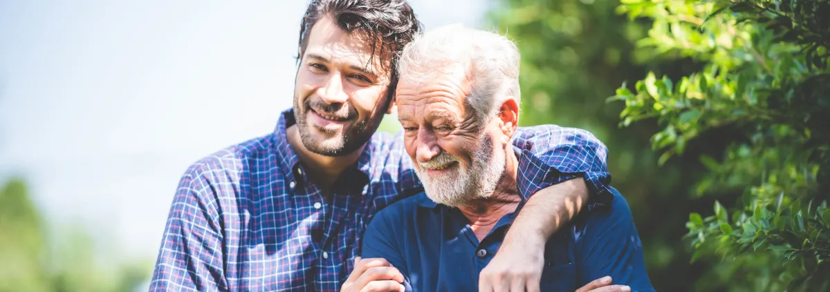 Two generations of men in outdoor setting