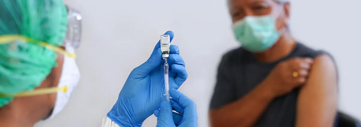 Patient receiving vaccine injection 