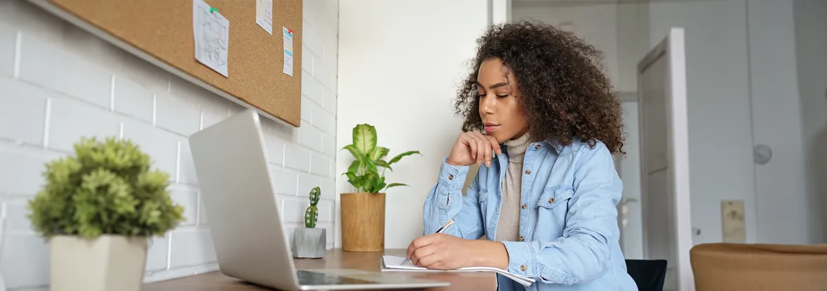 Person sitting at home on a laptop computer