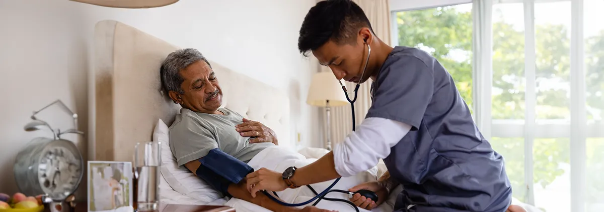 Image of someone taking a patient's blood pressure