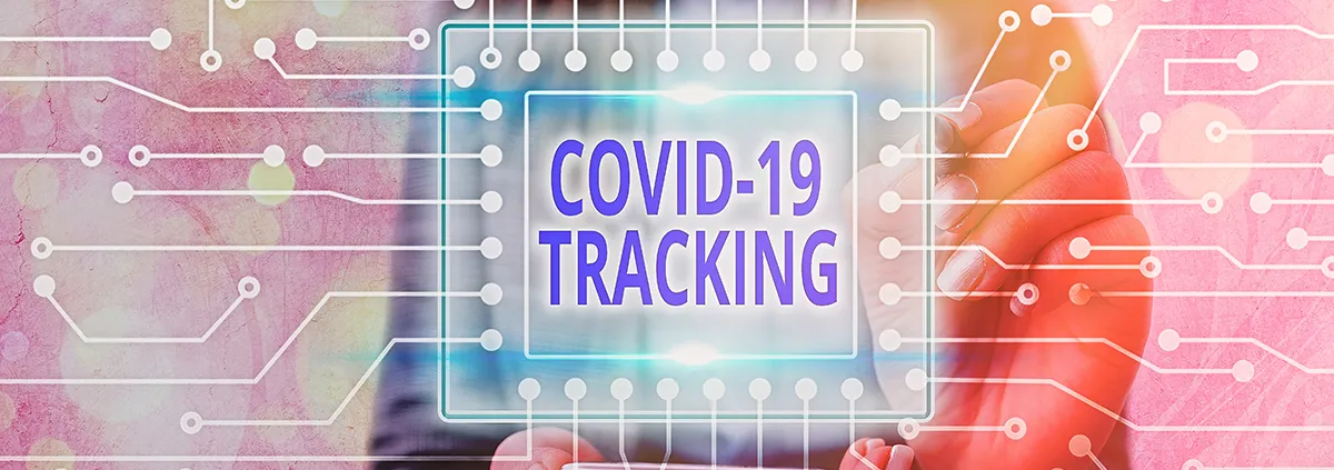 Photo of person holding a COVID-19 Tracking sign