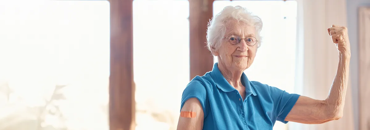 elderly person flexing arm