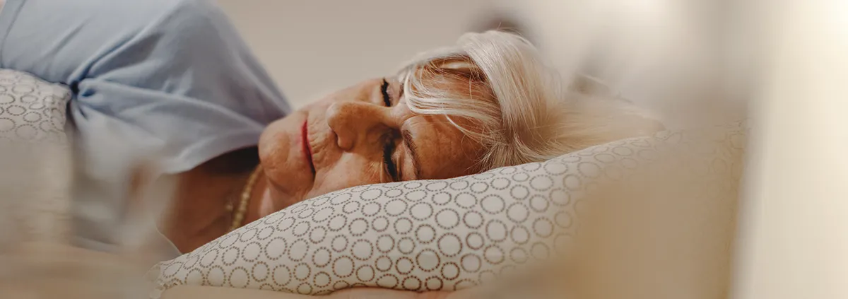 Older woman laying down sleep