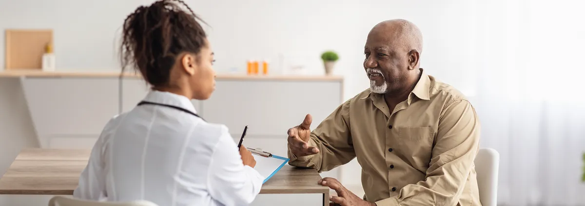 Patient talking to clinician during appointment