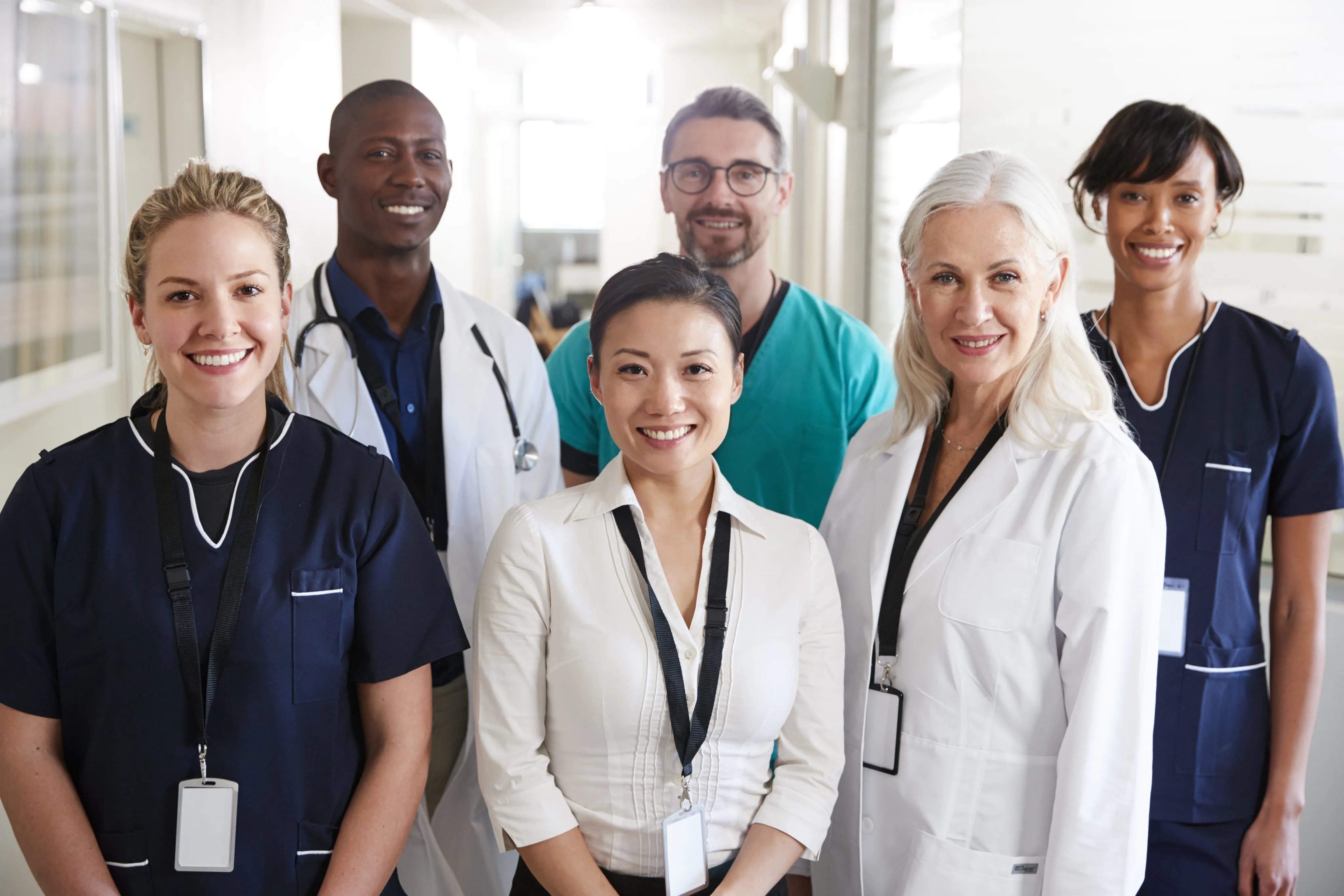 Portrait Of Medical Team Standing In Hospital Corridor